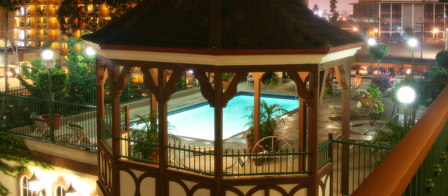  outdoor pool at camelot inn & suites